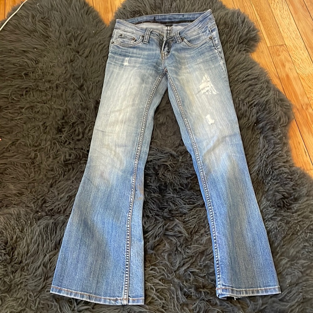 Low rise 2000s thrifted boot cut styled jeans.